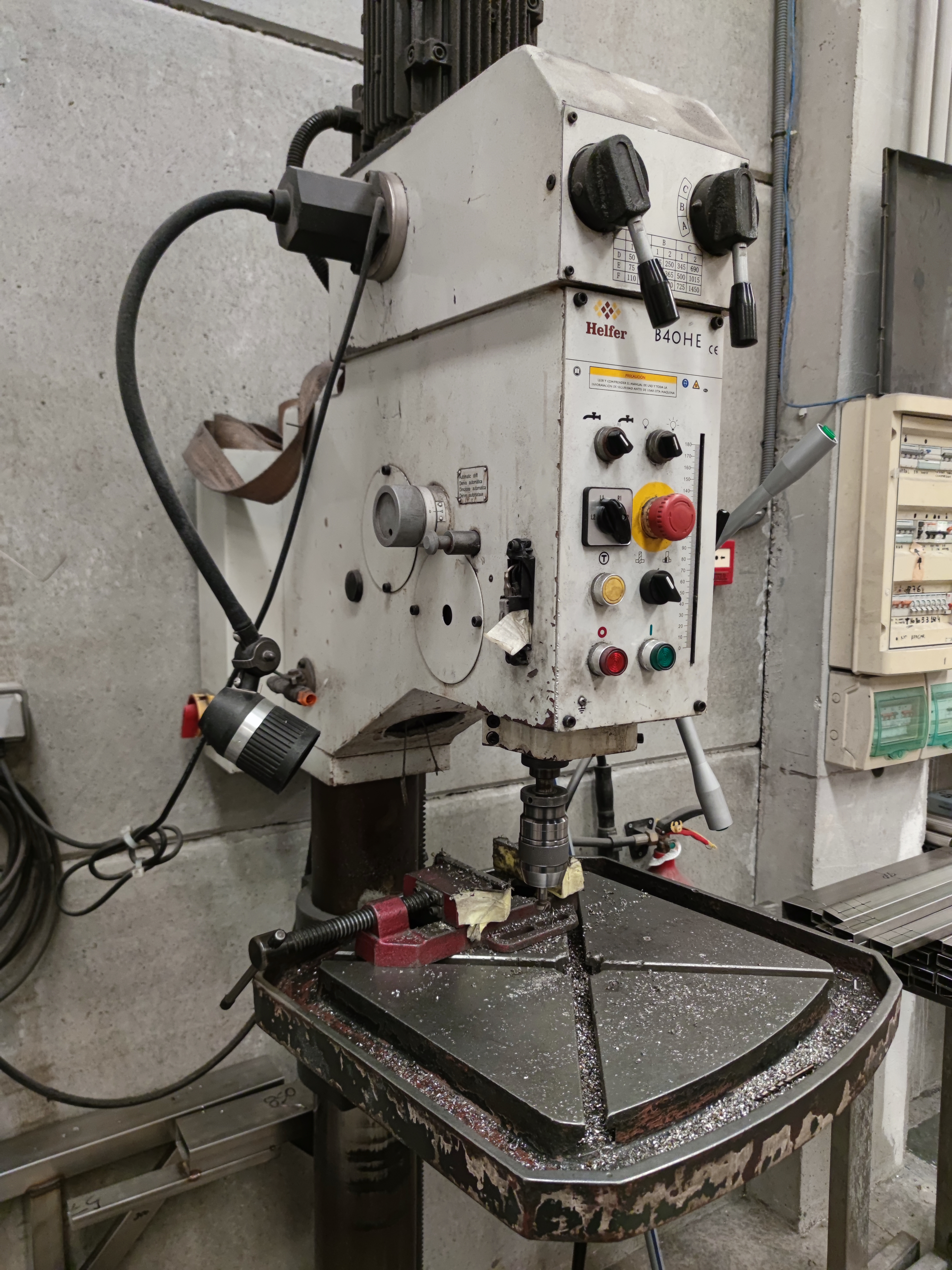 Manual drill press previously used for drilling rectangular steel tubes